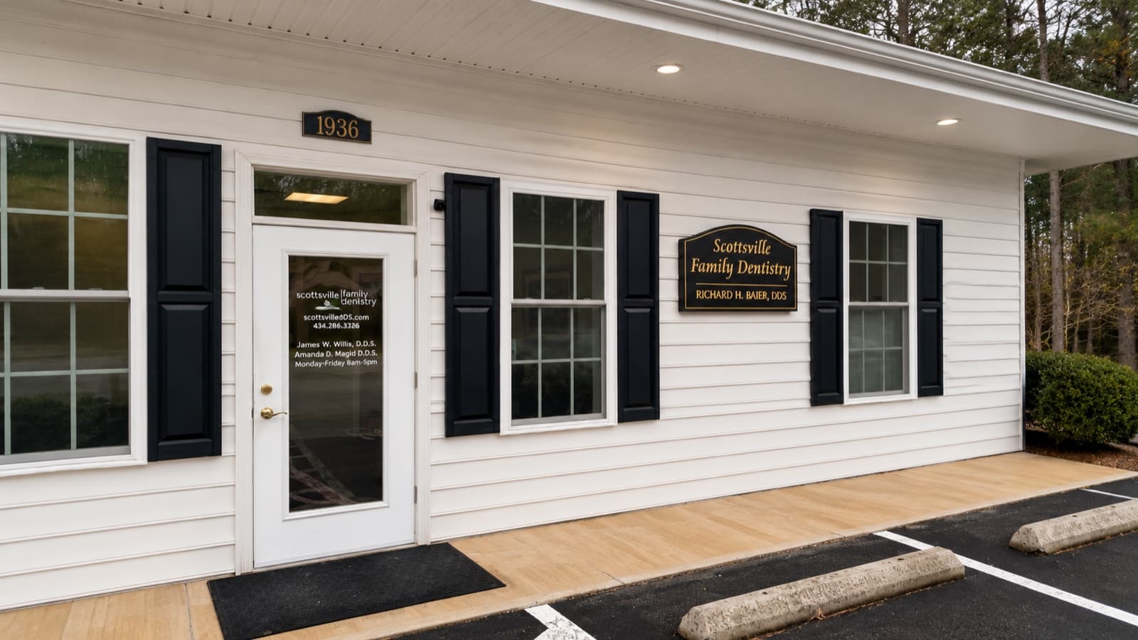 Front entrance of Scottsville Family Dentistry — white-clapboard building with black shutters